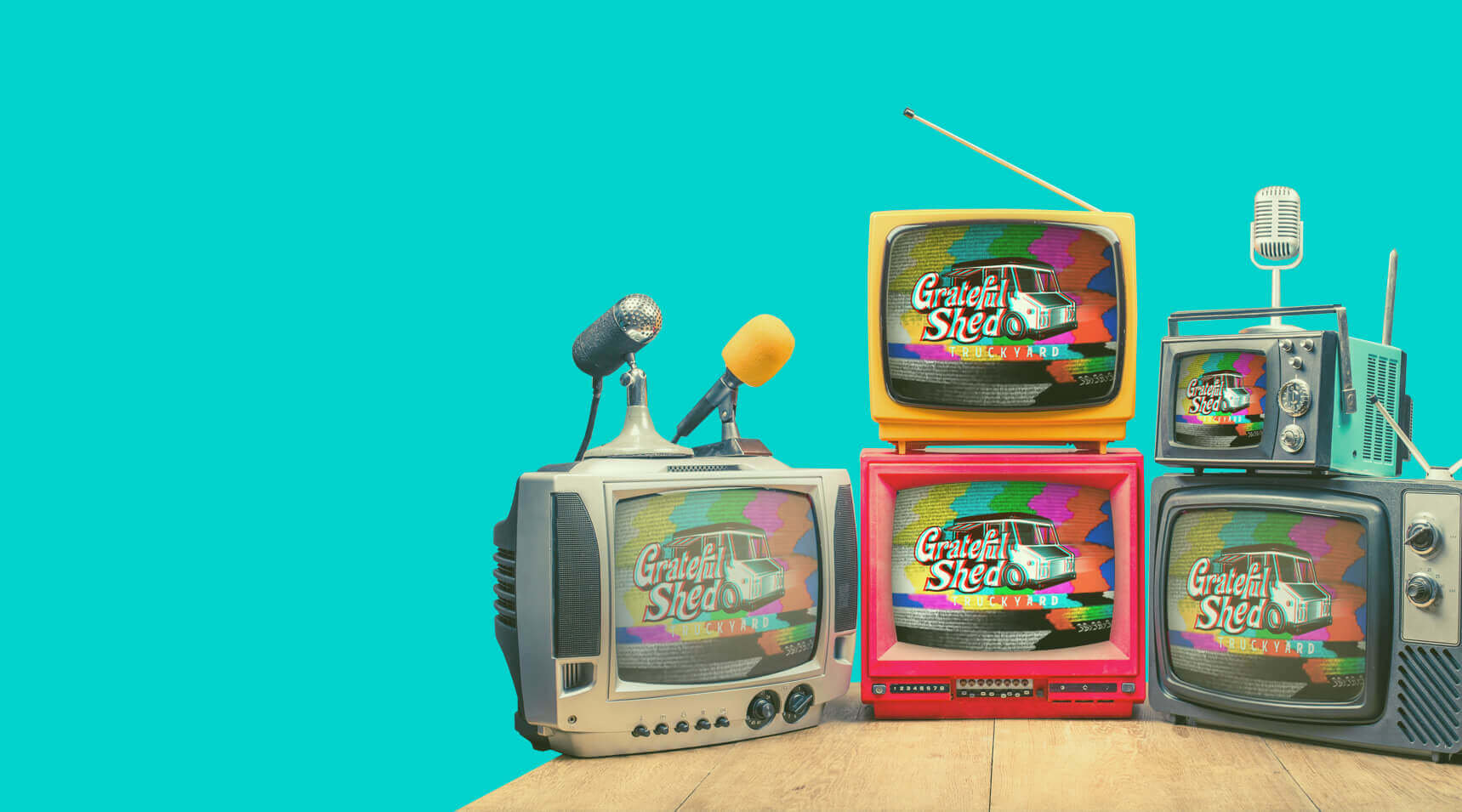 Retro TVs displaying the Grateful Shed Truckyard Logo